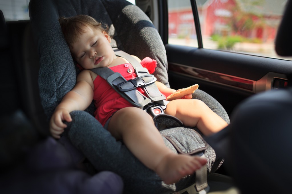 child sleeping in car seat