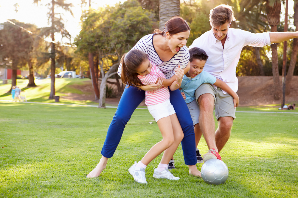 Family playing football - Image courtesy of Shutterstock