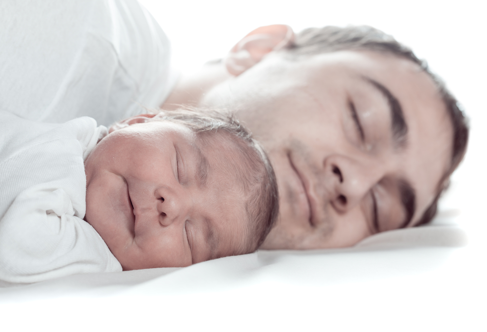 Dad and new baby sleeping image courtesy of Shutterstock