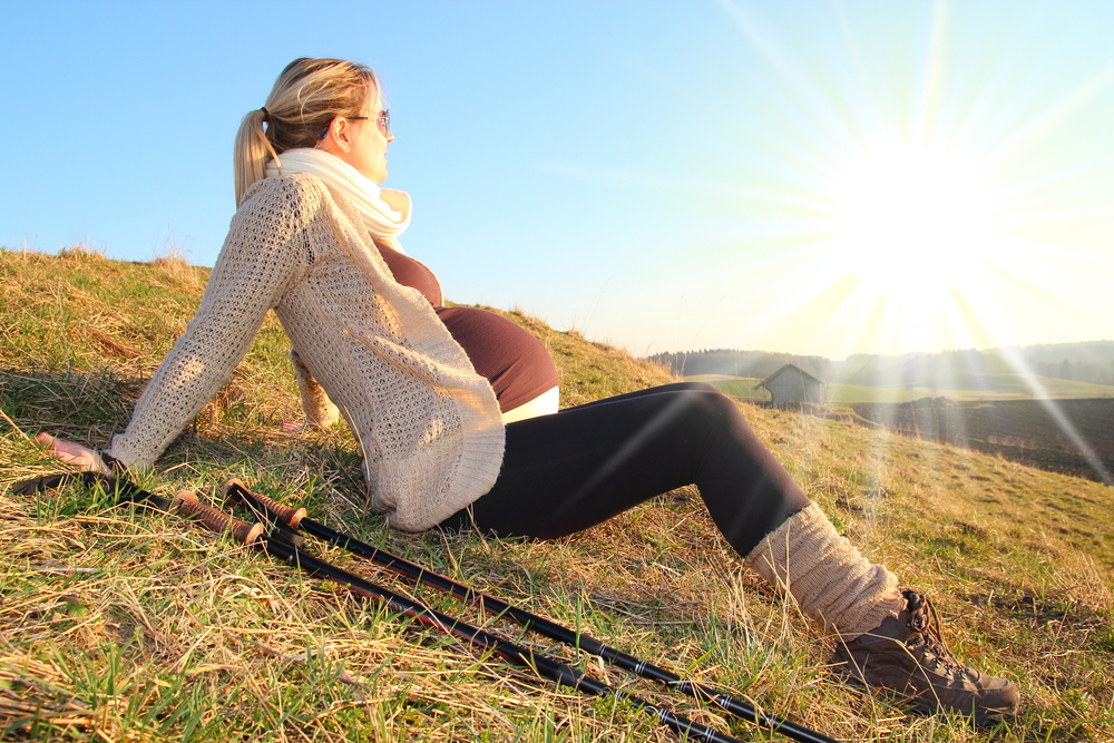 Pregnant woman hiking image courtesy of Shutterstock