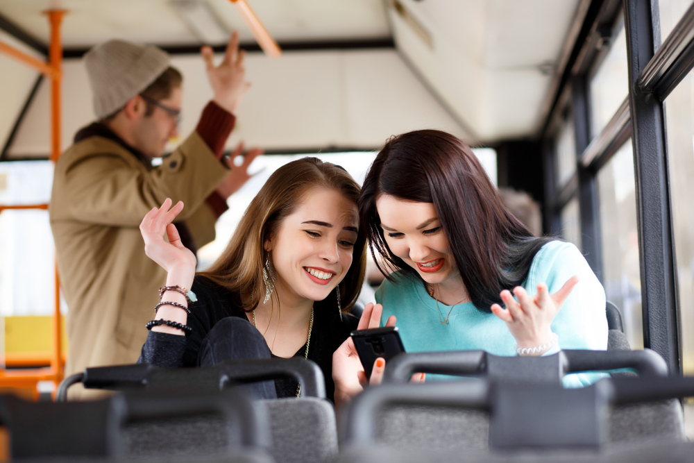 teens on bus image courtesy of Shutterstock