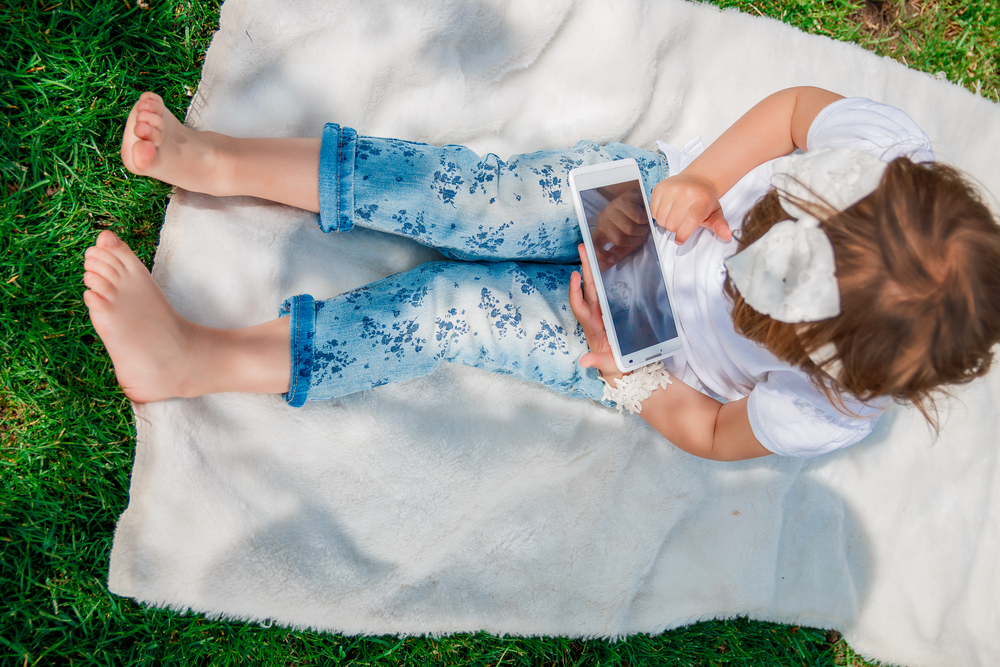 girl on tablet - image courtesy of shutterstock