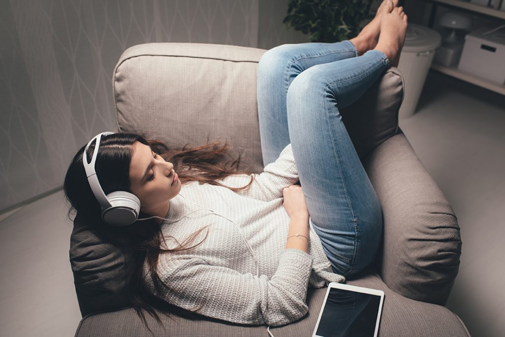 Teen listening to an audiobook.